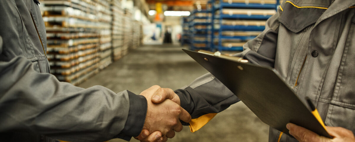 men shaking hands and making business deal with a co-packer